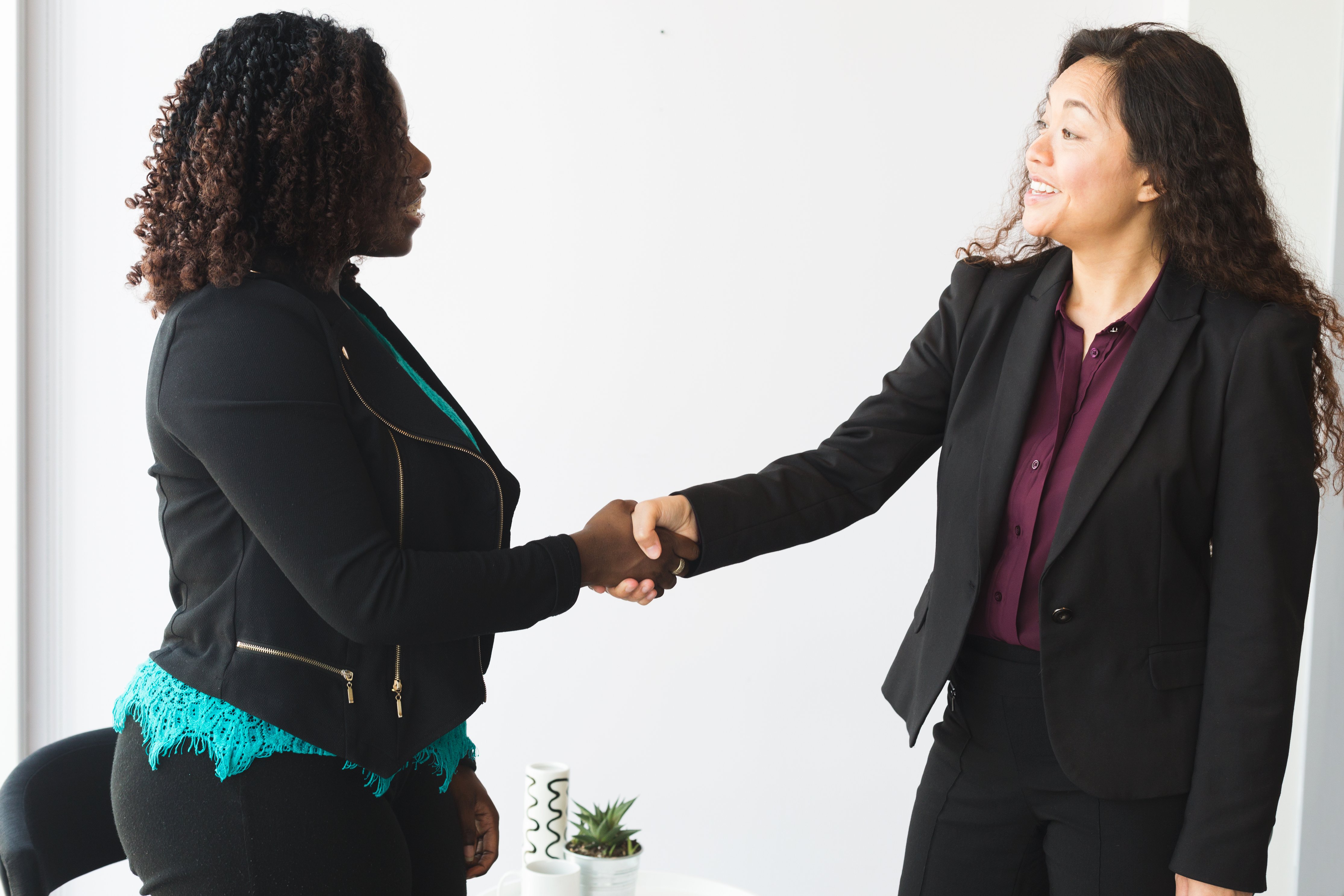 women handshaking